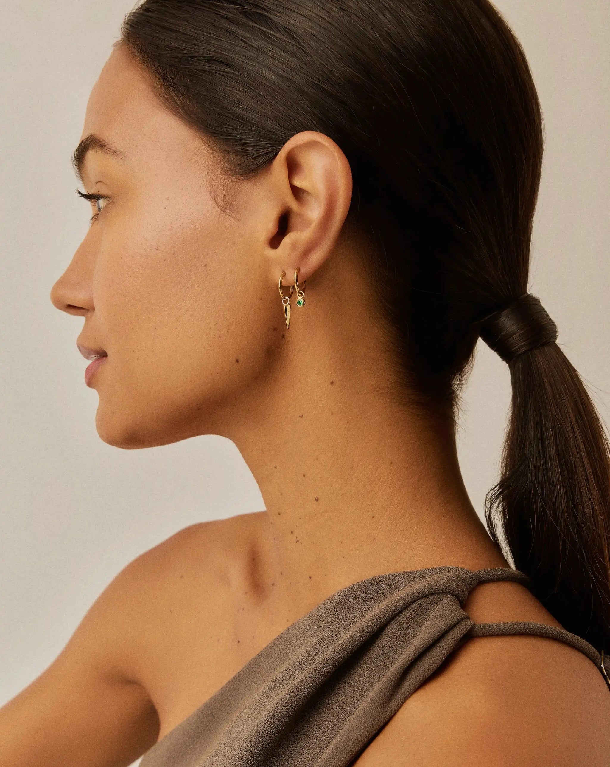 Tennis Charm Mini Hoop Earrings | 18ct Gold Vermeil/Emerald Green Nano-crystal Earrings Missoma