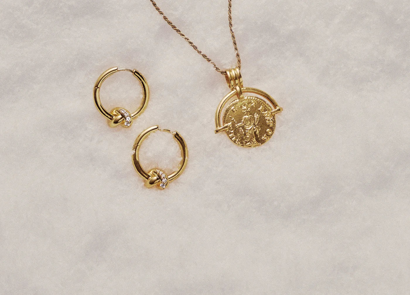 gold hoop earrings with gold coin necklace