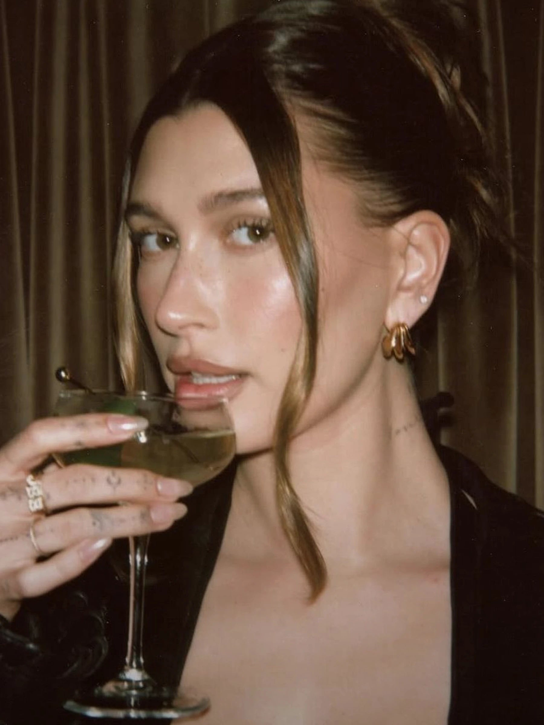 Hailey bieber wearing missoma gold hoop earrings