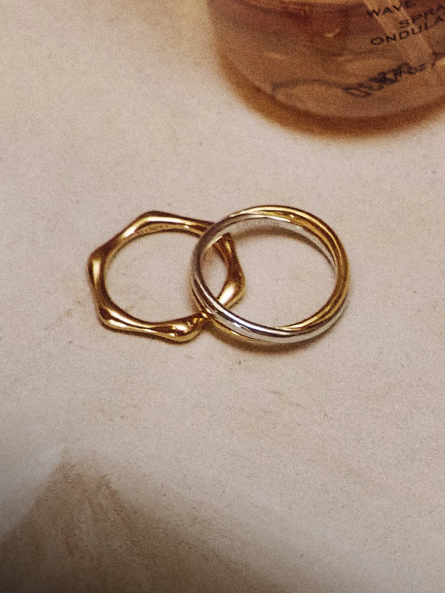 gold ring set ripple design with pave detail