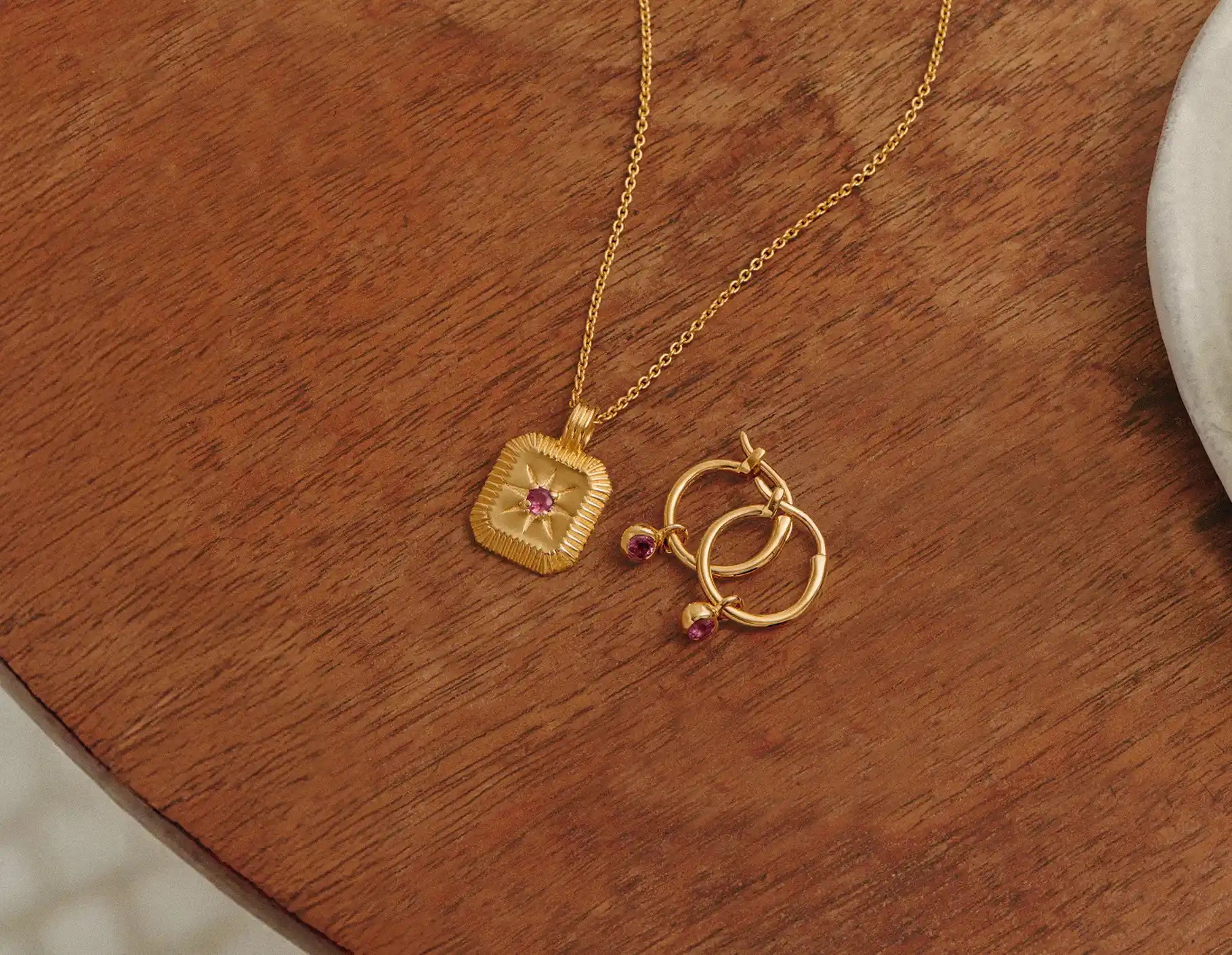 gold birthstone pendant necklace and birthstone charm hoop earrings