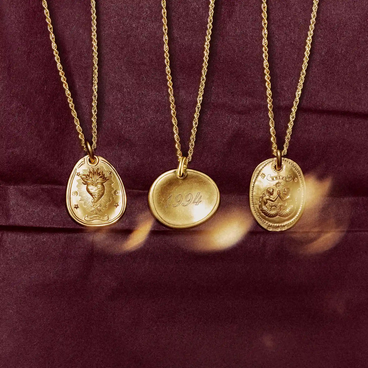 Hanging Talisman gold necklaces on gold chains