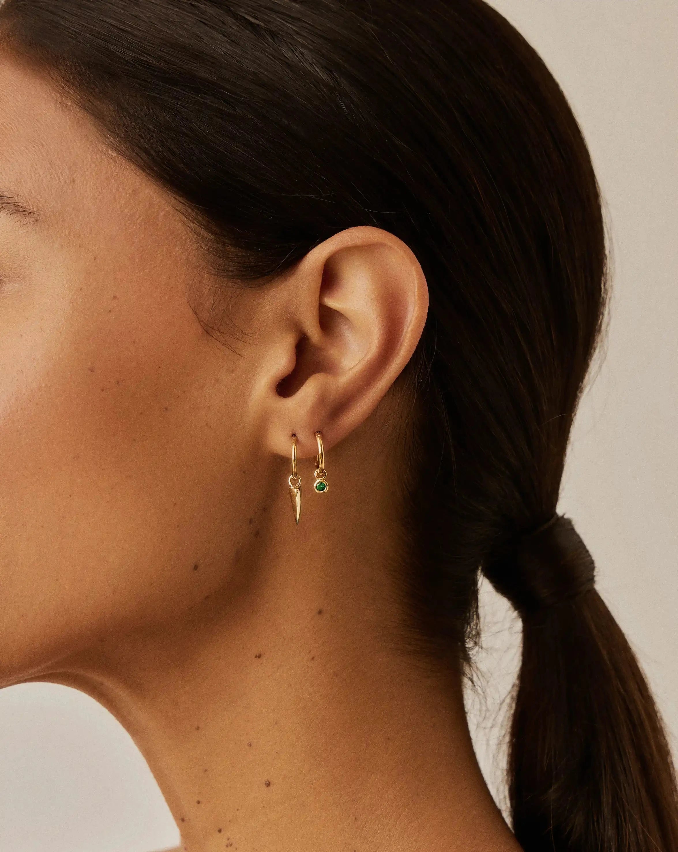 Tennis Charm Mini Hoop Earrings | 18ct Gold Vermeil/Emerald Green Nano-crystal Earrings Missoma 