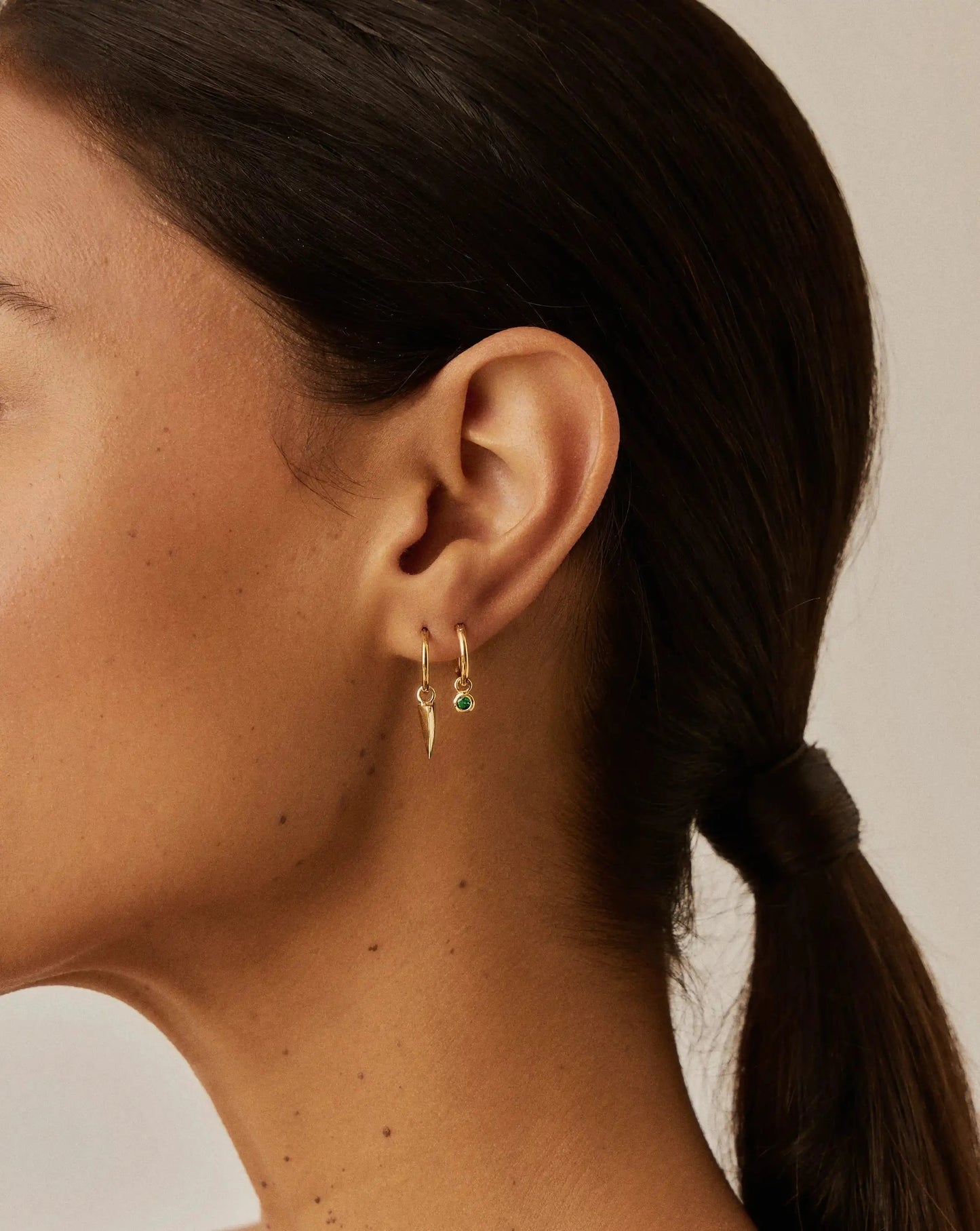 Tennis Charm Mini Hoop Earrings | 18ct Gold Vermeil/Emerald Green Nano-crystal Earrings Missoma 