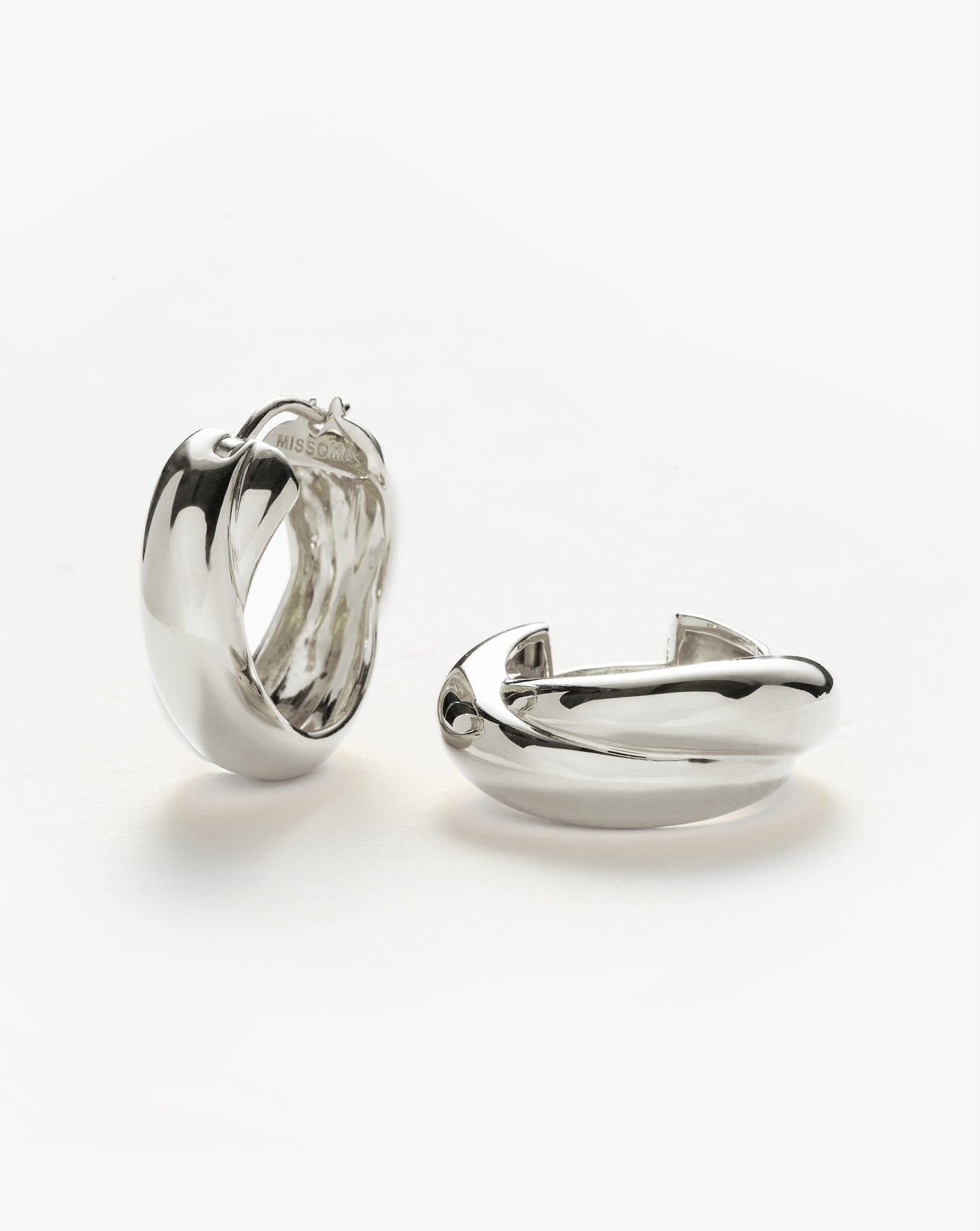 A best selling Lucy Williams x Missoma design, now for silver lovers. Inspired by 80s maximalism, these chunky hinged double hoops feature a unique crossover design. Just as standout on their own as they are part of a curated ear stack.